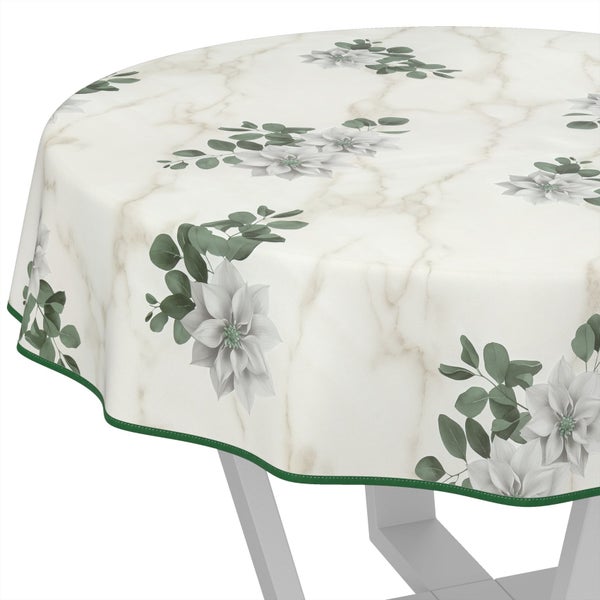 Runde Tischdecke mit Blumenmuster auf Tisch