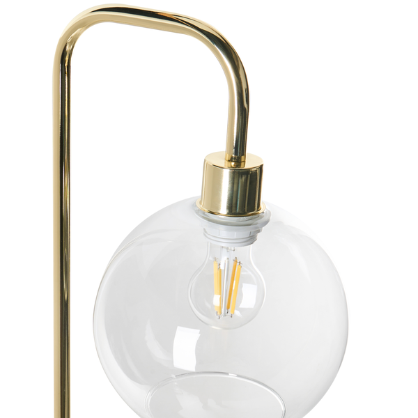 Tischleuchte mit goldfarbenem Metallgestell, rundem Schirm aus Klarglas und sichtbarem LED-Leuchtmittel.