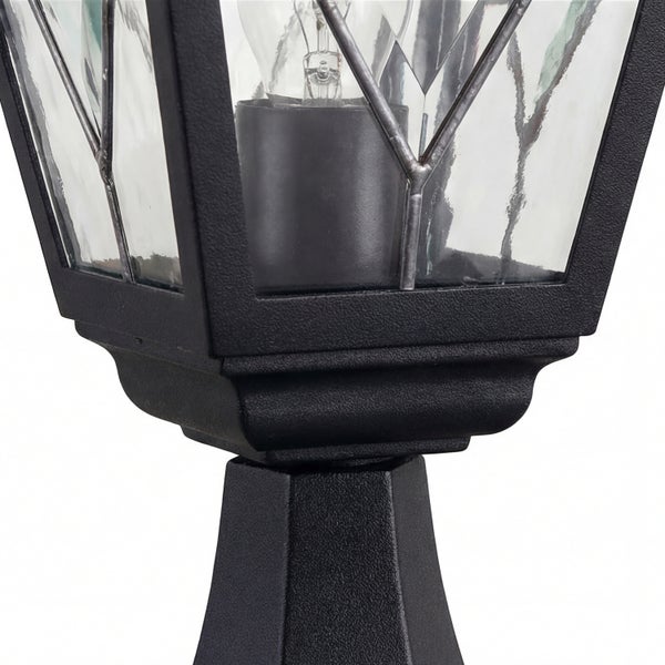 Detailaufnahme einer schwarzen Sockelleuchte mit Glaseinsätzen