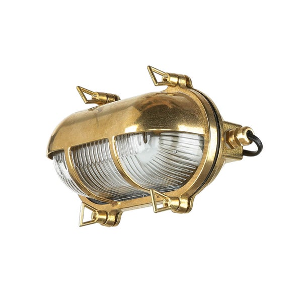 Messingfarbene Schiffslampe mit Schutzkorb und klarem Glas
