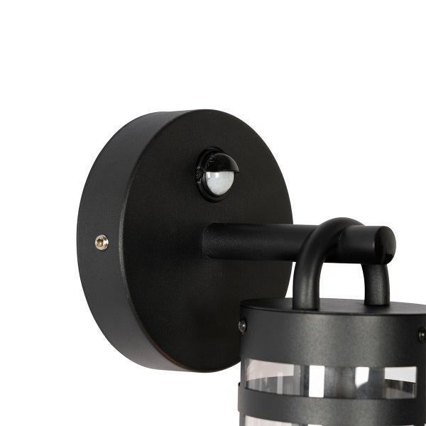 Schwarze Außenwandleuchte mit integriertem Bewegungsmelder, Metallgehäuse und zylindrischem Glaseinsatz.