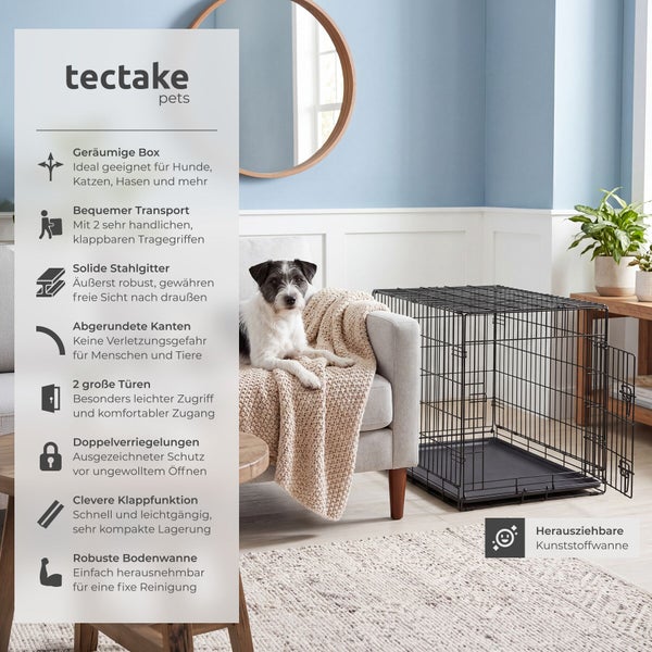 Tectake pets Hundetransportbox aus Metall mit zwei Türen, Doppelschloss, Klappfunktion und Bodenwanne in einem hellen Wohnzimmer mit einem Hund.