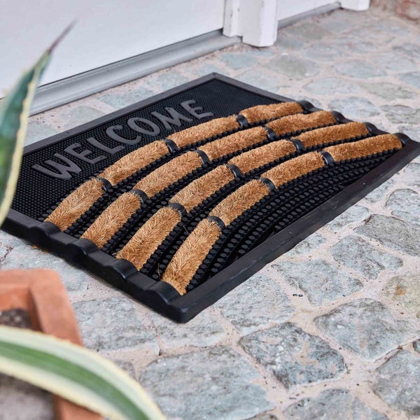 Fußmatte mit Willkommensgruß und Kokosfasern