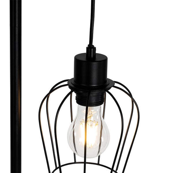 Detailaufnahme einer schwarzen Lampe mit Glühbirne und Metallkäfig