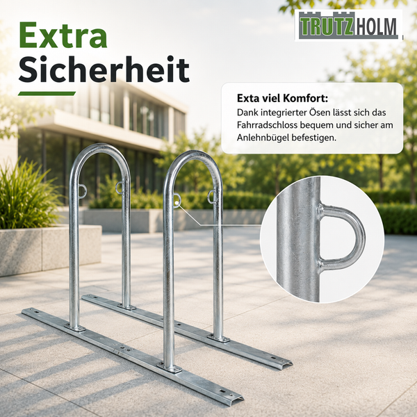 Trutzholm Logo. Zwei verzinkte Fahrrad-Anlehnbügel mit integrierten Ösen zum Sichern von Fahrradschlössern im Außenbereich.