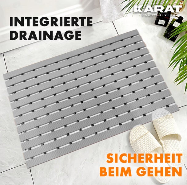 Graue Badematte mit integrierter Drainage und dem Karat Home Living Logo