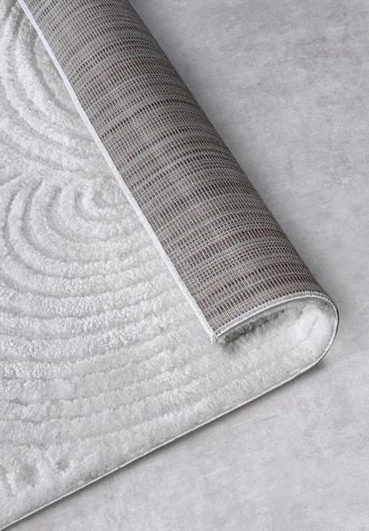 Teppich mit kreisförmigem Muster und Textilrückseite