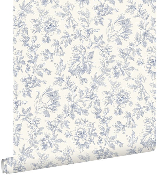 Vliestapete mit einem blauen Blumenmuster im Vintage-Stil.