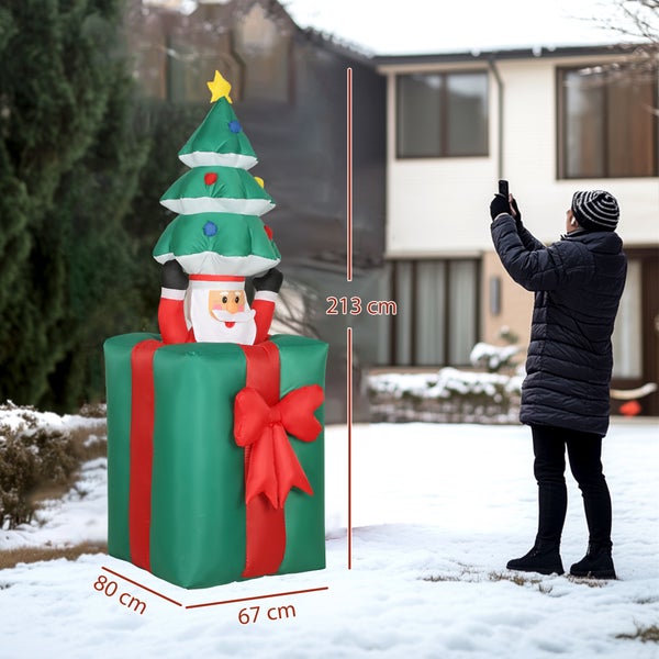 Aufblasbare Weihnachtsfigur Weihnachtsmann im Geschenkkarton mit Weihnachtsbaum, Höhe 213 Zentimeter, Breite 67 Zentimeter, Tiefe 80 Zentimeter.