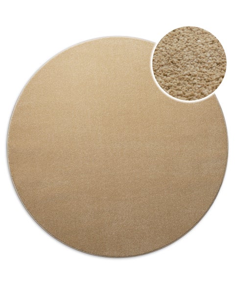 Runder Teppich in Beige mit Detailansicht der weichen Faserstruktur.