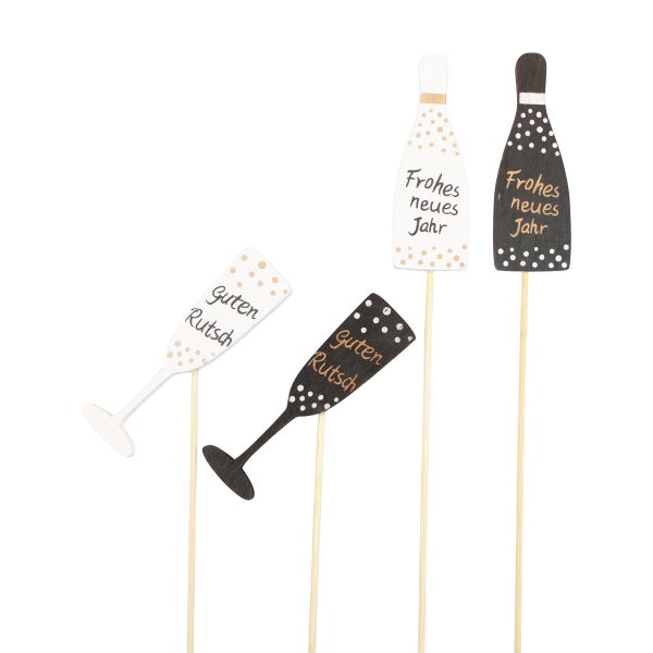 Dekorative Neujahrsstäbe mit Motiven von Sektflaschen und Sektgläsern