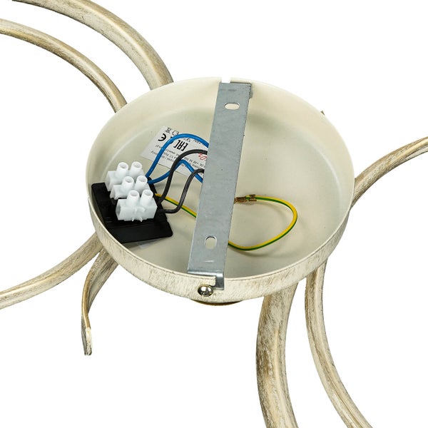 De Innenseite einer Deckenleuchte mit elektrischen Anschlüssen und Montagehalterung.