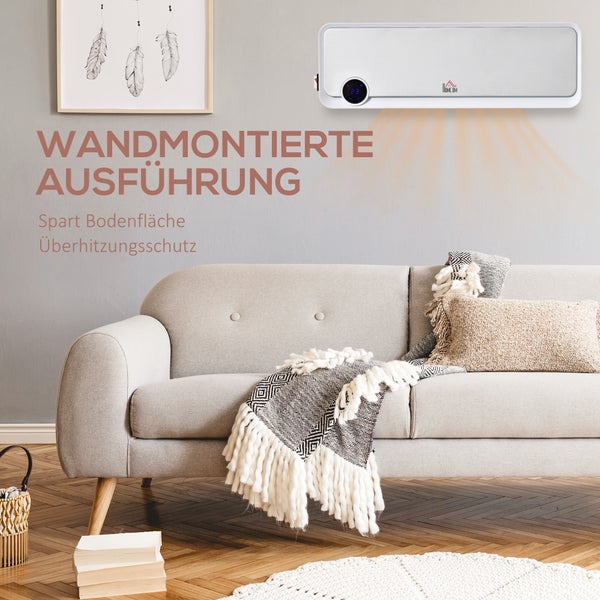 Wandmontierte elektrische Heizung in einem hellen, modern eingerichteten Wohnzimmer über einem grauen Stoffsofa für eine platzsparende Raumerwärmung.
