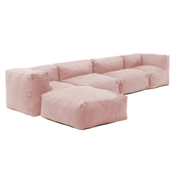 Modulares Sitzsack-Sofa in Rosa, bestehend aus mehreren Sitzelementen und einem Hocker, Material Textil.
