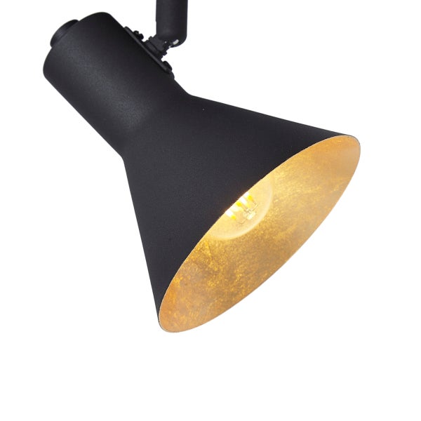Schwarzer Strahler mit goldfarbener Innenseite