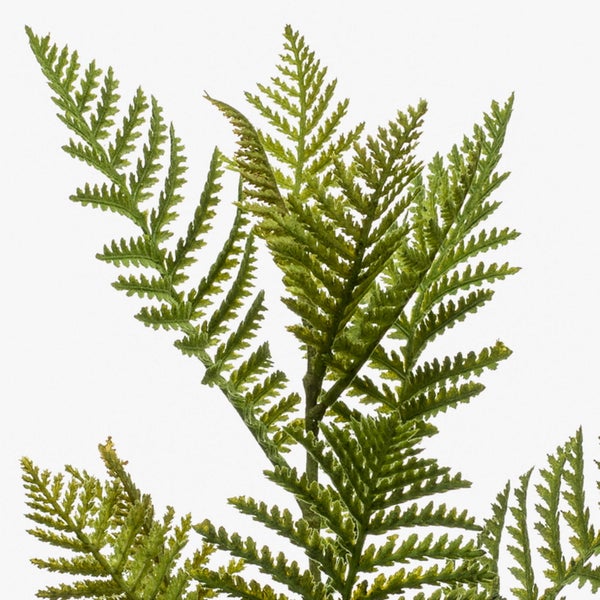 Detailansicht eines künstlichen Pflanzenstiels mit schmalen grünen Blättern.