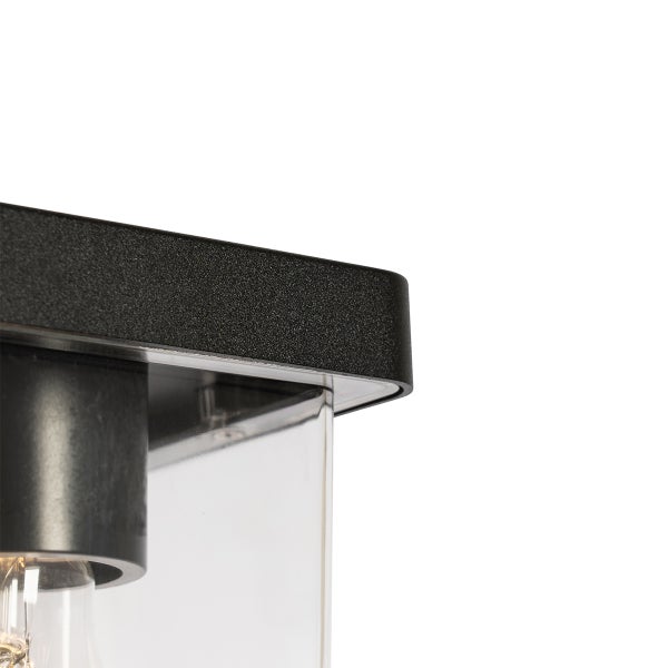 Detailansicht einer modernen Außenwandleuchte aus schwarzem Metall mit klarem Glas und sichtbarem Leuchtmittel.