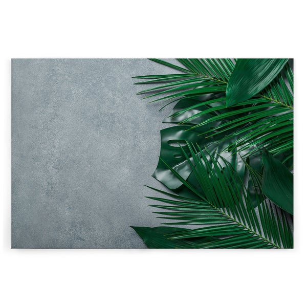 Wandbild mit tropischen Palmenblättern und Monstera auf grauem, strukturiertem Untergrund als dekoratives Leinwandbild.