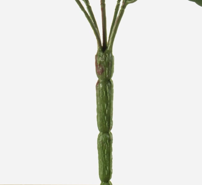 Nahaufnahme eines grünen, strukturierten Stiels einer Kunstpflanze mit Verzweigungen am oberen Ende.