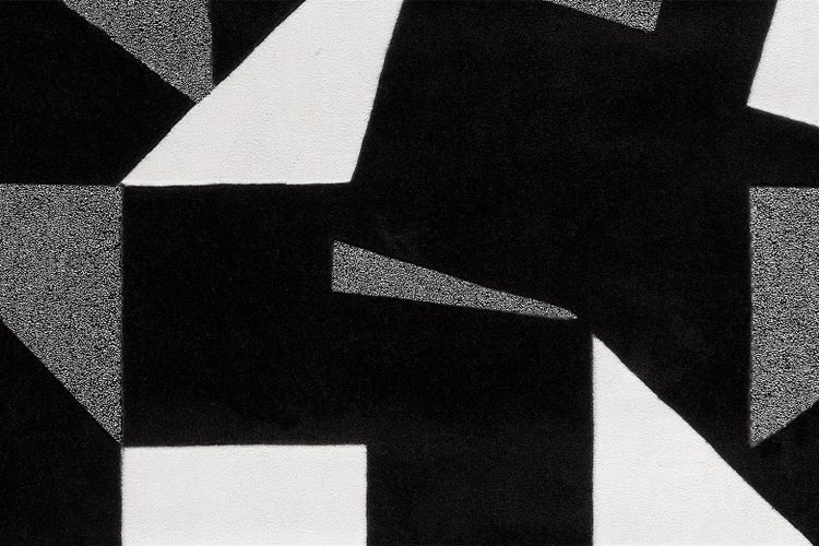 Tapete mit modernem geometrischem Muster aus Flächen in verschiedenen Texturen