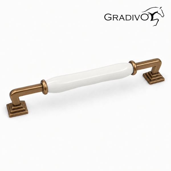 Klassischer Möbelgriff aus Metall in Bronze-Optik mit weißem Keramik-Element. Gradivo Logo.