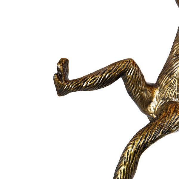 Detailaufnahme einer Affenfigur aus Metall