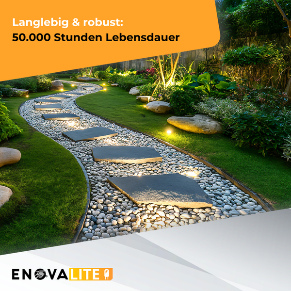 Beleuchteter Gartenweg mit Steinplatten und weißen Kieselsteinen