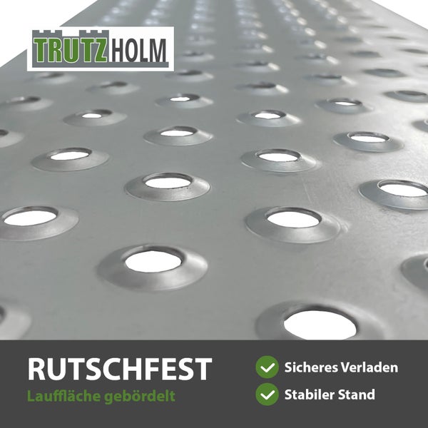 Trutzholm Logo. Rutschfeste Auffahrrampe aus Metall mit gebördelter Lauffläche für sicheres Verladen und stabilen Stand.