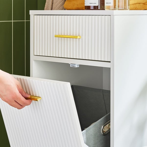 Weißer Badezimmerschrank mit Schublade und Tür mit goldenen Griffen