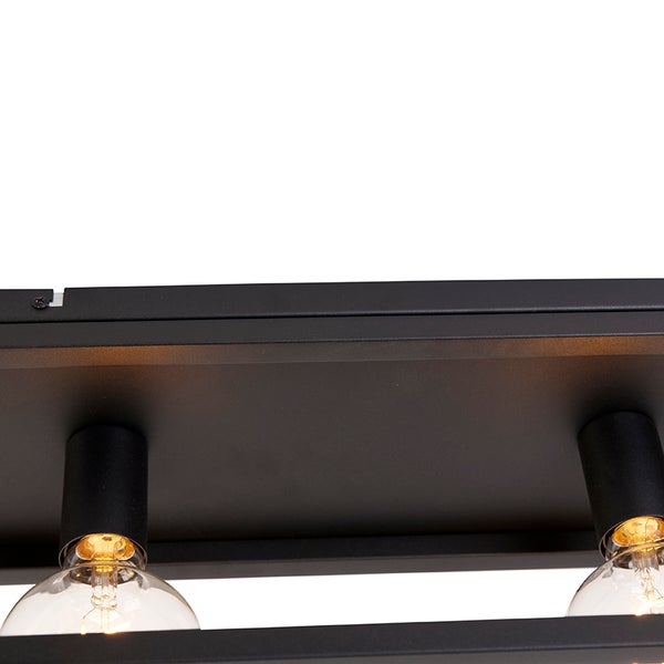 Detailaufnahme einer schwarzen Deckenleuchte mit Glühbirnen