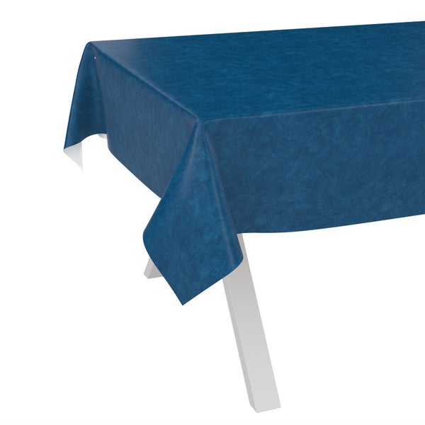 Blaue Wachstuch-Tischdecke mit marmorierter Struktur an einer Tischecke.