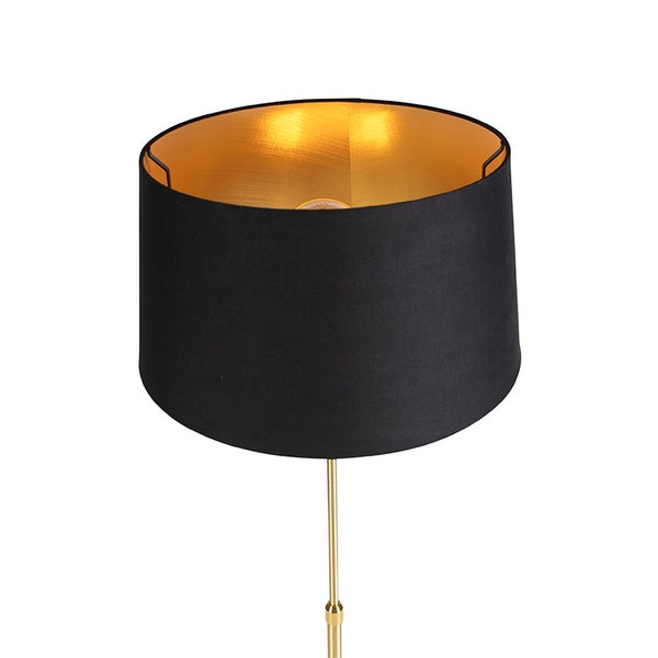 Lampenschirm aus Stoff in Schwarz mit goldener Innenseite auf einem goldfarbenen Metallgestell.