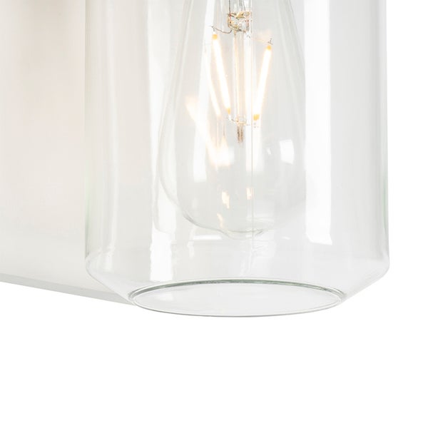 Detailansicht einer Lampe mit klarem Glaszylinder und eingeschaltetem LED-Filament-Leuchtmittel.