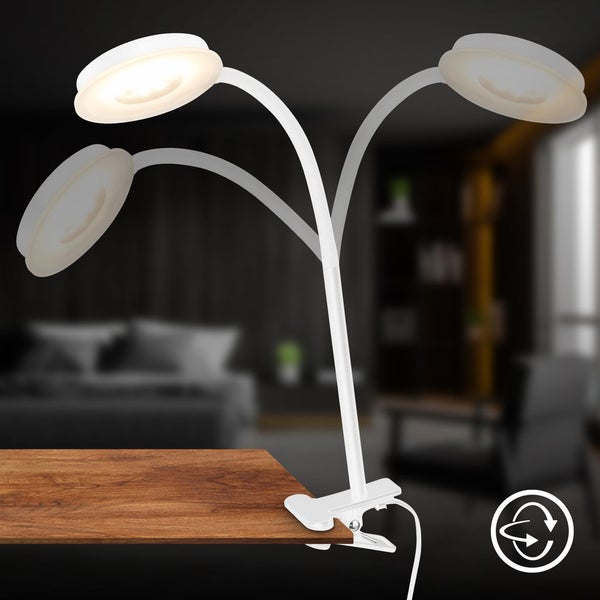 LED Klemmleuchte mit flexiblem Schwanenhals und rundem Kopf, befestigt an einer Holztischkante, in verschiedene Positionen verstellbar.