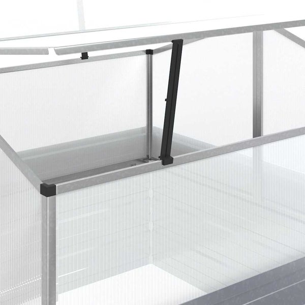 Automatischer Fensteröffner montiert an einem Frühbeet mit Hohlkammerplatten und Aluminiumrahmen.