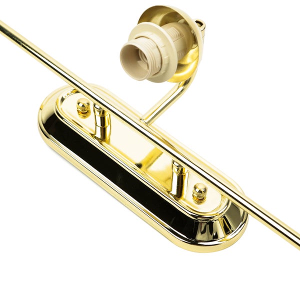 Detailaufnahme einer goldenen Lampenhalterung mit Fassung