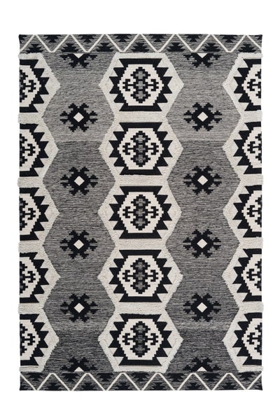 Gewebter Teppich mit geometrischem Muster, Rautenmotiven und Zickzack-Bordüre.