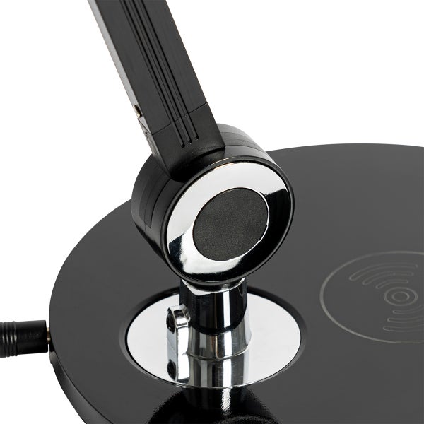 Detailaufnahme einer schwarzen Tischleuchte mit verstellbarem Arm und runder Basis