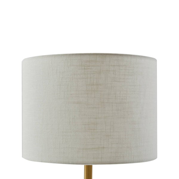 Zylindrischer Lampenschirm aus strukturiertem beigem Stoff mit einem goldfarbenen Metallsockel.