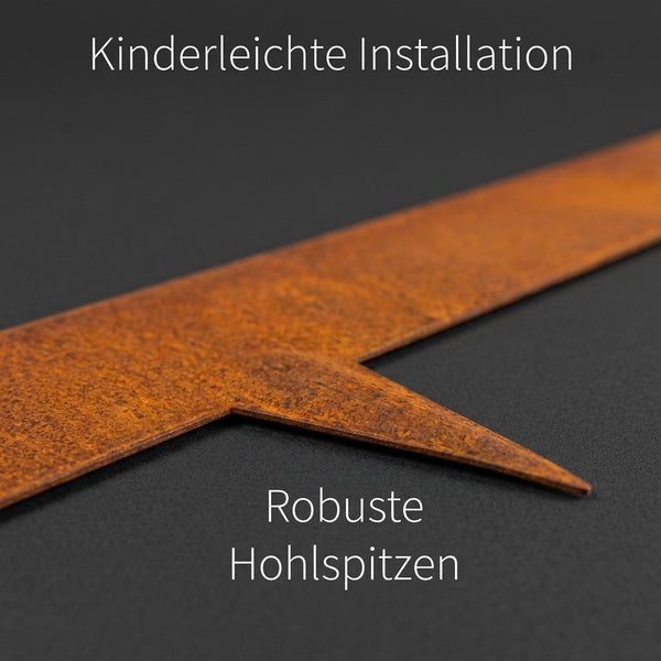Eine Metall Rasenkante mit spitzem Erdanker für einfache Montage im Garten.