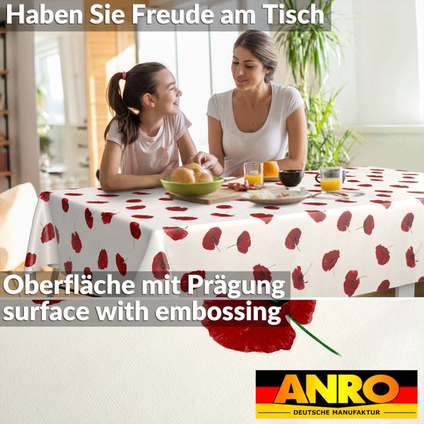 Wachstuchdecke mit Mohnblumenmuster, geprägte Oberfläche, helle Szene mit Mutter und Kind am Tisch, ANRO Logo.