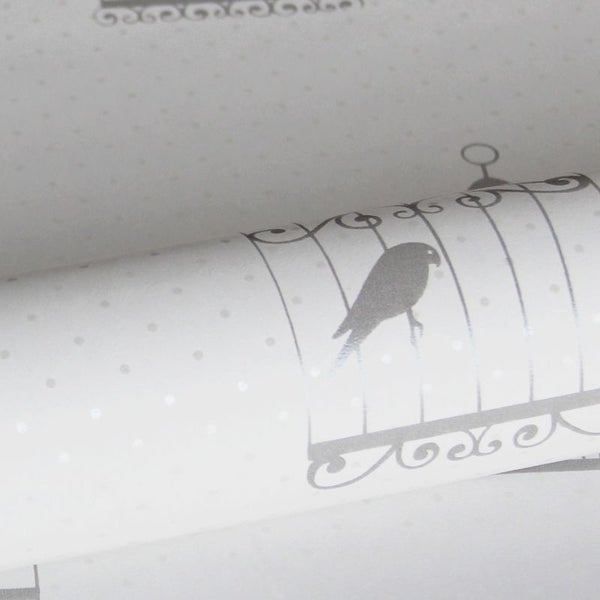 Tapetenrolle mit Vogelkäfigmuster und Punktmuster