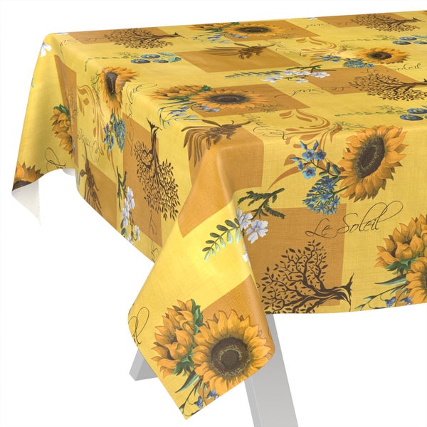Tischdecke mit Sonnenblumen-Muster, blauen Blumen und Baum-Motiven auf gelbem Grund.