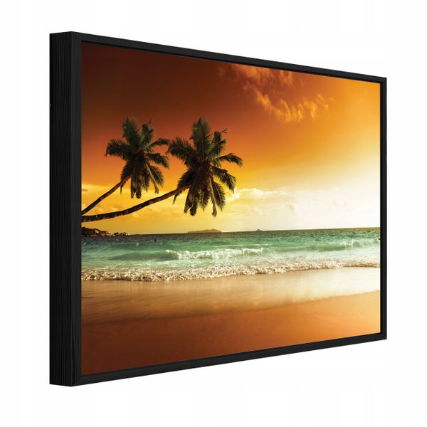 Wandbild im schwarzen Rahmen mit tropischem Strandmotiv bei Sonnenuntergang und Palmen