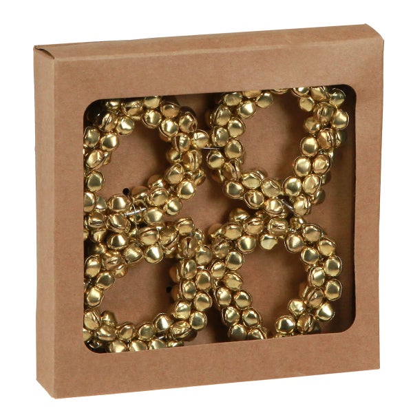 Vier goldene Glockenringe in einer braunen Verpackung