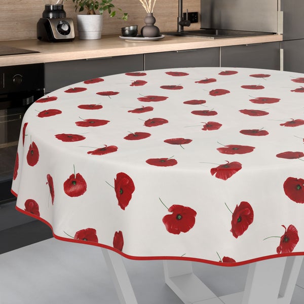 Runde Tischdecke mit Mohnblumenmuster auf einem Küchentisch.