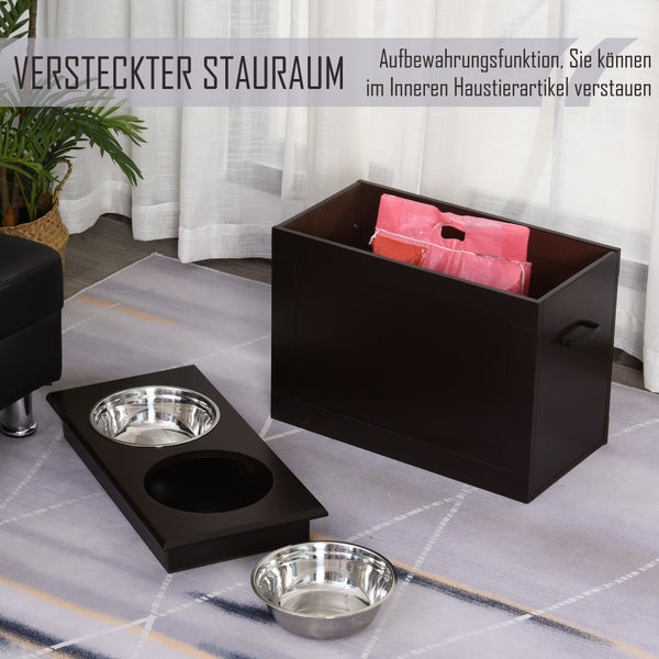 Futterstation aus dunklem Holz mit zwei Edelstahlnäpfen und integriertem Stauraum für Tiernahrung in einem hellen Wohnraum.