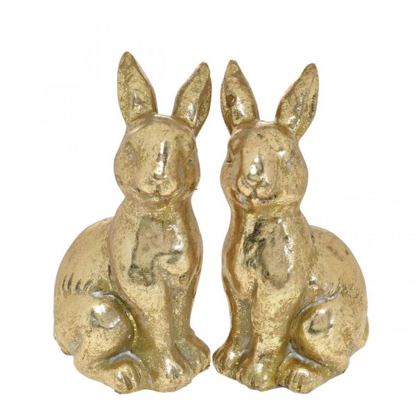 Zwei goldene Hasenfiguren als Osterdekoration