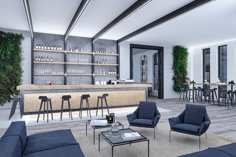 Moderne Bar und Lounge mit Holztresen, blauen Sesseln, LED-Deckenbeleuchtung an Balken und vertikalen Gärten an grauen Wänden.