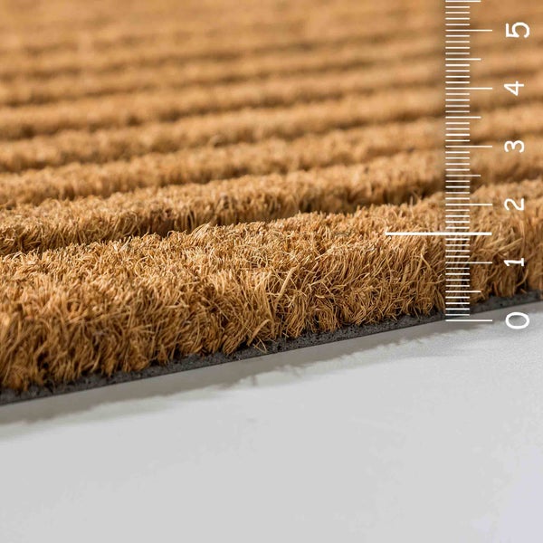 Kokosmatte mit Messskala zur Darstellung der Dicke